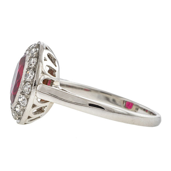 Estate ring: a Platinum Red Spinel And Diamond Halo 2.27ct. Engagement Ring sold by Doyle & Doyle vintage and antique jewelry boutique.