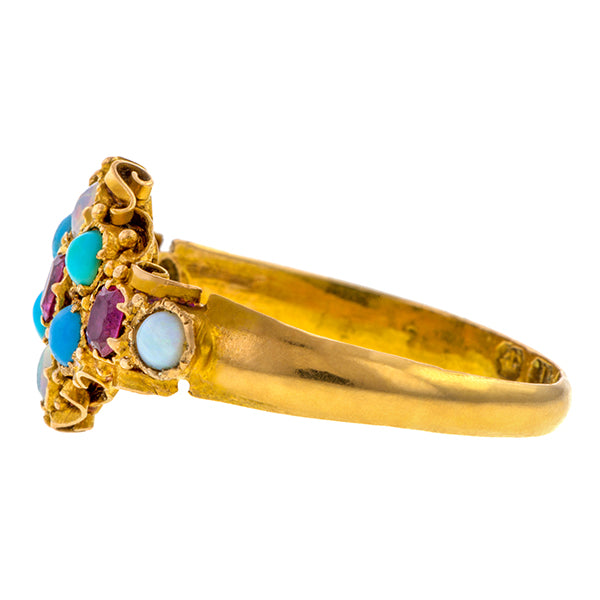 Antique ring: a 18k Yellow Gold Gemstone Ring With Rubies, Turquoises And Cabochon Opals Wirework Mounting Engagement Ring  sold by Doyle & Doyle vintage and antique jewelry boutique. 