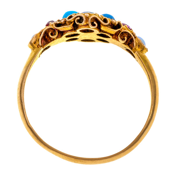 Antique ring: a 18k Yellow Gold Gemstone Ring With Rubies, Turquoises And Cabochon Opals Wirework Mounting Engagement Ring  sold by Doyle & Doyle vintage and antique jewelry boutique. 