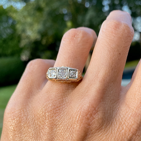 Vintage ring; a Yellow & White Gold Three Stone Diamond Filigree Old European Cut Engagement Ring sold by Doyle & Doyle vintage and antique jewelry boutique.