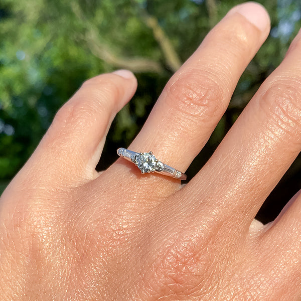 Vintage ring: a White Gold Round Brilliant, Baguette and Single Cut Diamond Engagement Ring sold by Doyle & Doyle vintage and antique jewelry boutique.