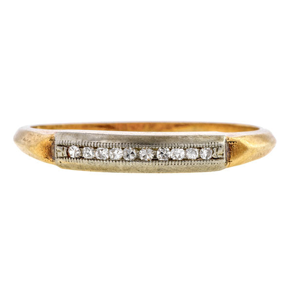 Vintage ring: a White And Yellow Gold Channel Set Single Cut Diamond Wedding Band sold by Doyle & Doyle vintage and antique jewelry boutique.