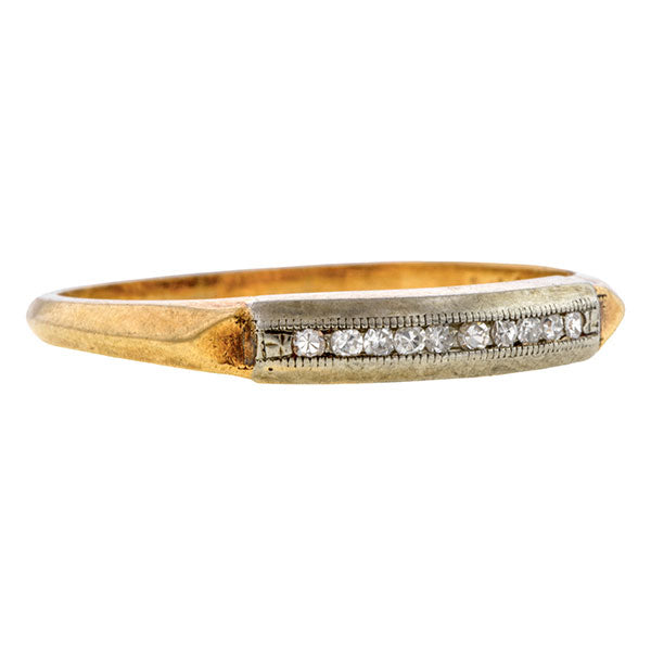Vintage ring: a White And Yellow Gold Channel Set Single Cut Diamond Wedding Band sold by Doyle & Doyle vintage and antique jewelry boutique.