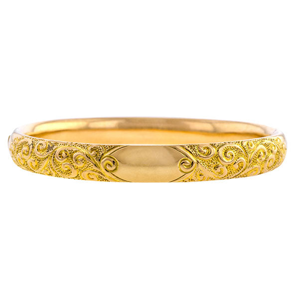Vintage bracelet: a Yellow Gold With A Scroll Motif Bangle sold by Doyle & Doyle vintage and antique jewelry boutique.