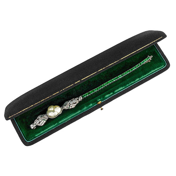 Art Deco bracelet: a Platinum Natural Pearl, Emerald And Diamond Bracelet sold by Doyle & Doyle vintage and antique jewelry boutique.