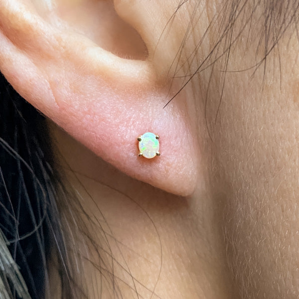 Oval Cabochon Opal Stud Earrings, sold by Doyle & Doyle an antique and estate jewelry boutique.