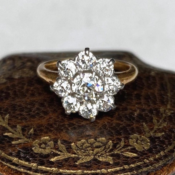 Antique diamond cluster ring in gold, from Doyle & Doyle.