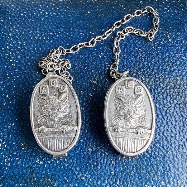 Antique ABC Cat Bib Clips sold by Doyle and Doyle an antique and vintage jewelry boutique