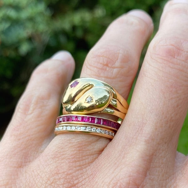 Vintage Gold Ruby & Diamond Snake Ring stacked with ruby and diamond eternity bands, sold by Doyle & Doyle antique and vintage jewelry boutique.