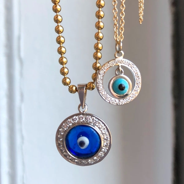 Vintage gold ball chain necklace and evil eye pendants, from Doyle & Doyle