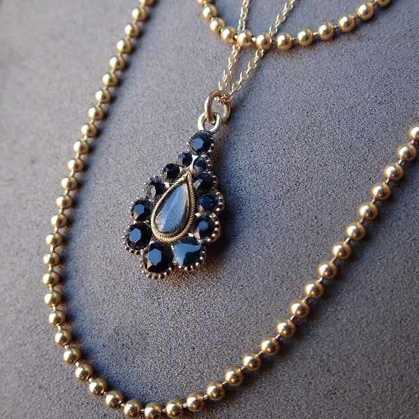 Vintage gold ball chain necklace and Victorian onyx pendant, from Doyle & Doyle