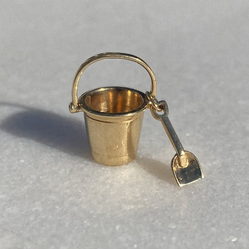 Vintage Sand Pail & Shovel Charm sold by Doyle and Doyle an antique and vintage jewelry boutique