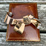 Retro Diamond Bow Brooch sold by Doyle and Doyle an antique and vintage jewelry boutique