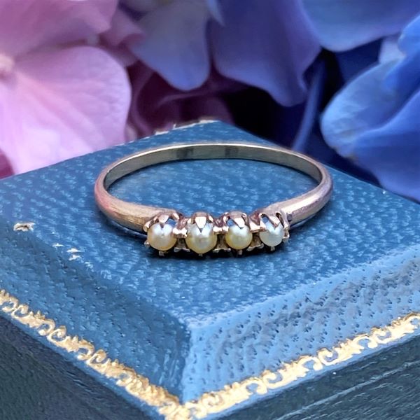 Vintage Four Stone Pearl Ring sold by Doyle and Doyle an antique and vintage jewelry boutique