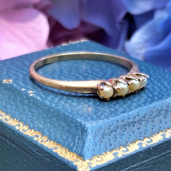 Vintage Four Stone Pearl Ring sold by Doyle and Doyle an antique and vintage jewelry boutique