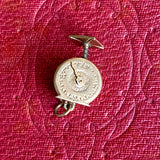 Vintage Mechanical Scale Charm sold by Doyle and Doyle an antique and vintage jewelry boutique