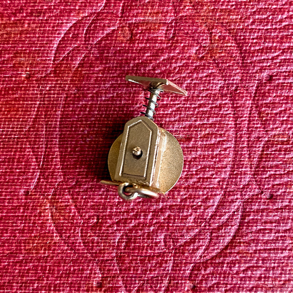 Vintage Mechanical Scale Charm sold by Doyle and Doyle an antique and vintage jewelry boutique