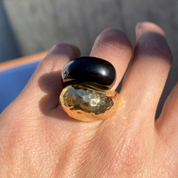 Vintage Onyx & Gold Crossover Ring sold by Doyle and Doyle an antique and vintage jewelry boutique