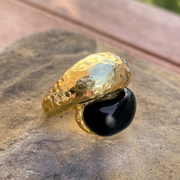 Vintage Onyx & Gold Crossover Ring sold by Doyle and Doyle an antique and vintage jewelry boutique