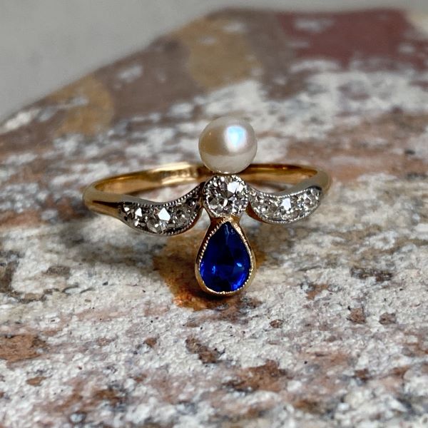 Edwardian Sapphire, Pearl & Diamond Ring sold by Doyle and Doyle an antique and vintage jewelry boutique