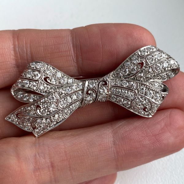Art Deco Diamond Bow sold by Doyle and Doyle an antique and vintage jewelry boutique