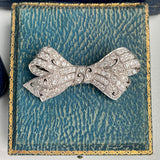 Art Deco Diamond Bow sold by Doyle and Doyle an antique and vintage jewelry boutique