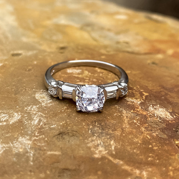 Vintage Cushion Cut Diamond Engagement ring with baguette diamonds, from Doyle & Doyle.