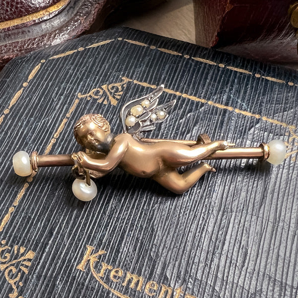 Antique Cherub Pin sold by Doyle and Doyle an antique and vintage jewelry boutique