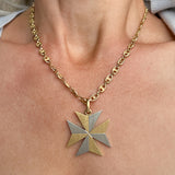 Vintage Two-toned Maltese Cross sold by Doyle and Doyle an antique and vintage jewelry boutique