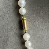 Vintage Pearl Necklace with emerald and ruby drops, sold by Doyle & Doyle antique and vintage jewelry boutique