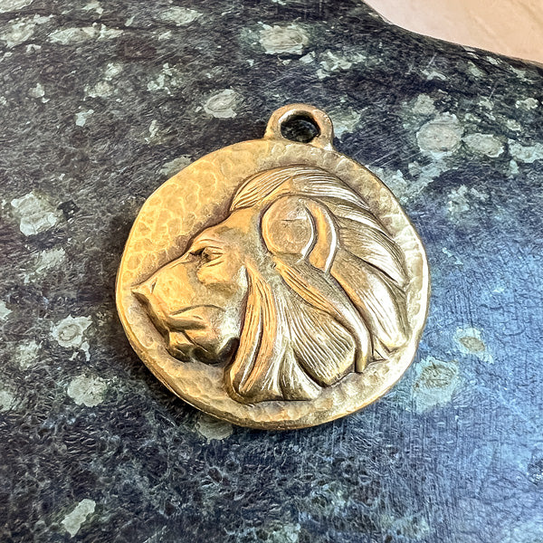 Vintage Lion Charm sold by Doyle and Doyle an antique and vintage jewelry boutique