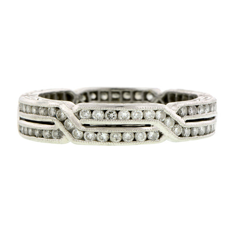 Contemporary ring: a Platinum Geometric Crossover Round Brilliant Cut Diamond Eternity Band sold by Doyle & Doyle vintage and antique jewelry boutique.