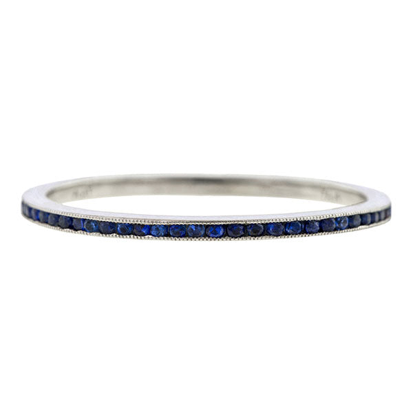 Contemporary ring: a Platinum Sapphire Eternity Wedding Band sold by Doyle & Doyle vintage and antique jewelry boutique.