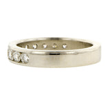 Estate ring: a Platinum Round Brilliant Cut Diamond Wedding Band sold by Doyle & Doyle vintage and antique jewelry boutique.