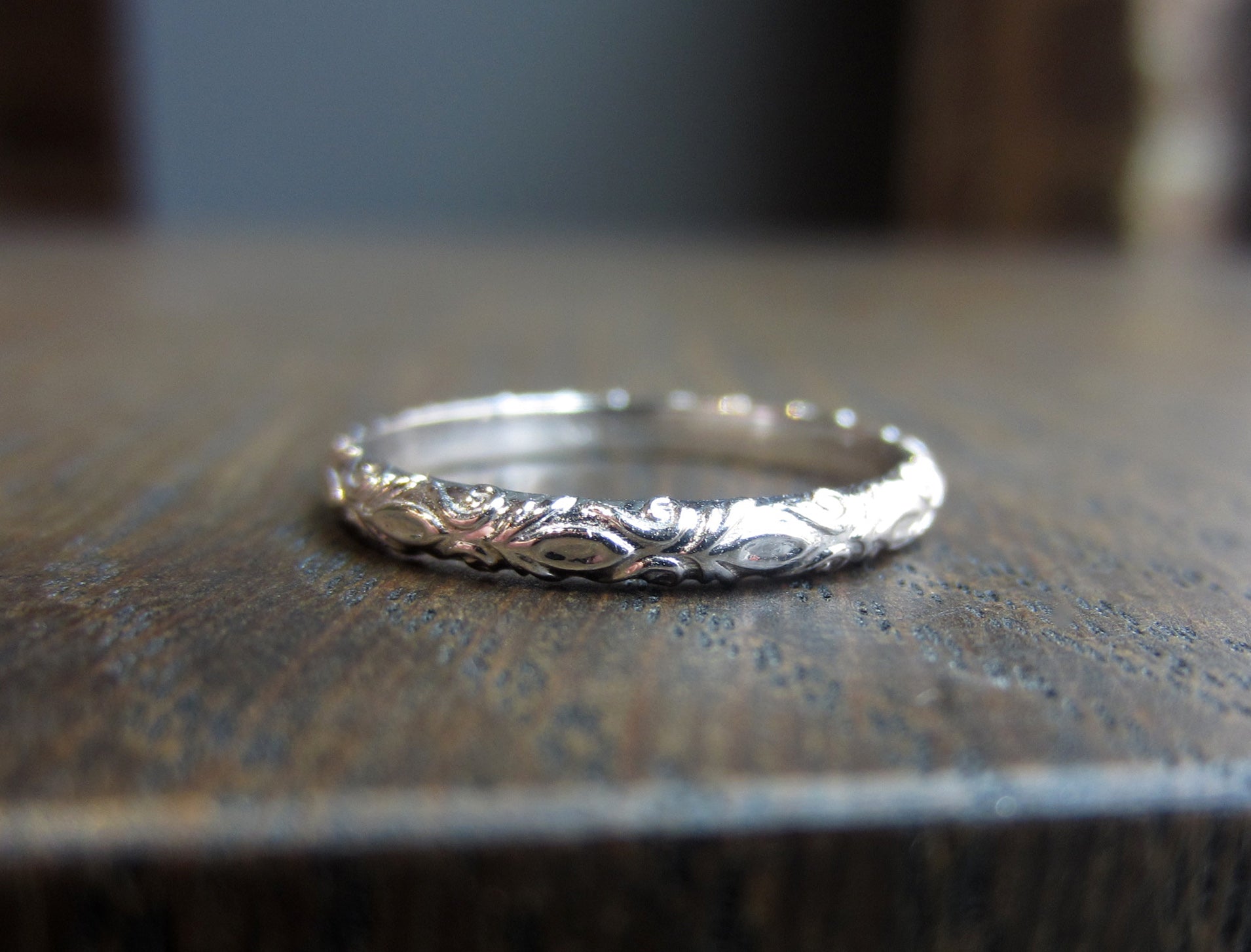 Contemporary ring: a White Gold Fleur Patterned Gold Band- Heirloom sold by Doyle & Doyle vintage and antique jewelry boutique.