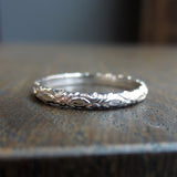 Contemporary ring: a White Gold Fleur Patterned Gold Band- Heirloom sold by Doyle & Doyle vintage and antique jewelry boutique.