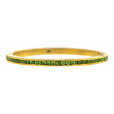 Contemporary ring; a Yellow Gold Tsavorite Wedding Eternity Band sold by Doyle & Doyle vintage and antique jewelry boutique.