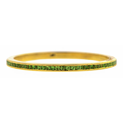 Contemporary ring; a Yellow Gold Tsavorite Wedding Eternity Band sold by Doyle & Doyle vintage and antique jewelry boutique.
