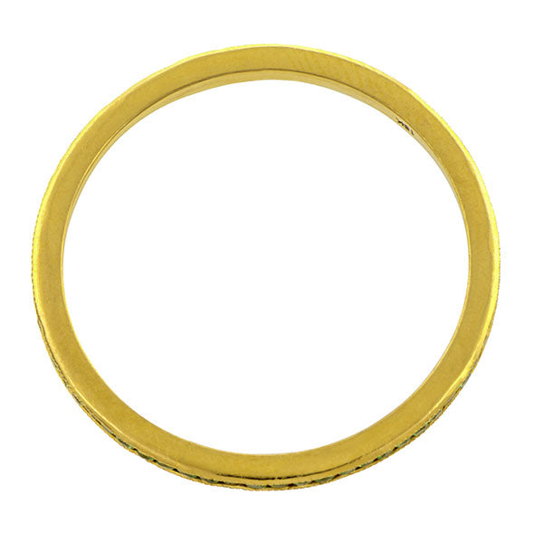 Contemporary ring; a Yellow Gold Tsavorite Wedding Eternity Band sold by Doyle & Doyle vintage and antique jewelry boutique.