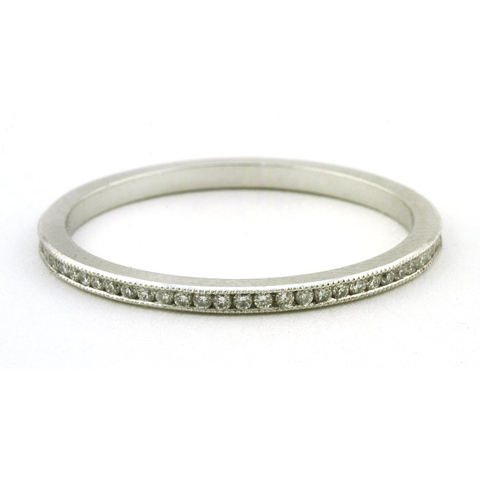 Contemporary ring: a Platinum Channel Set Diamond Eternity Wedding Band sold by Doyle & Doyle vintage and antique jewelry boutique.