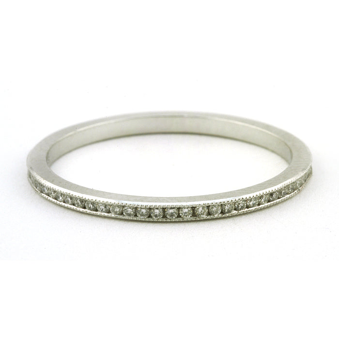 Contemporary ring: a Platinum Channel Set Diamond Eternity Wedding Band sold by Doyle & Doyle vintage and antique jewelry boutique.