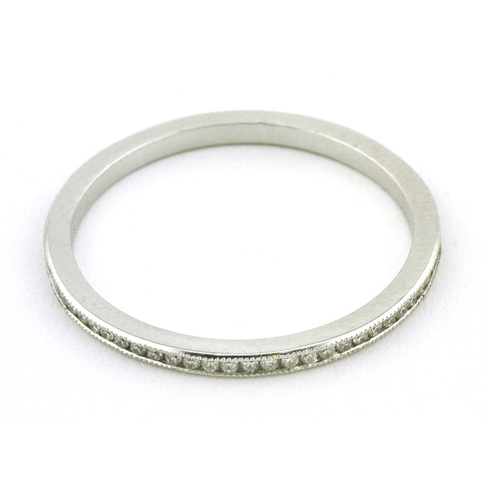 Contemporary ring: a Platinum Channel Set Diamond Eternity Wedding Band sold by Doyle & Doyle vintage and antique jewelry boutique.