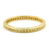 Contemporary ring: a Yellow Gold Channel Set Diamond Eternity Wedding Band sold by Doyle & Doyle vintage and antique jewelry boutique.