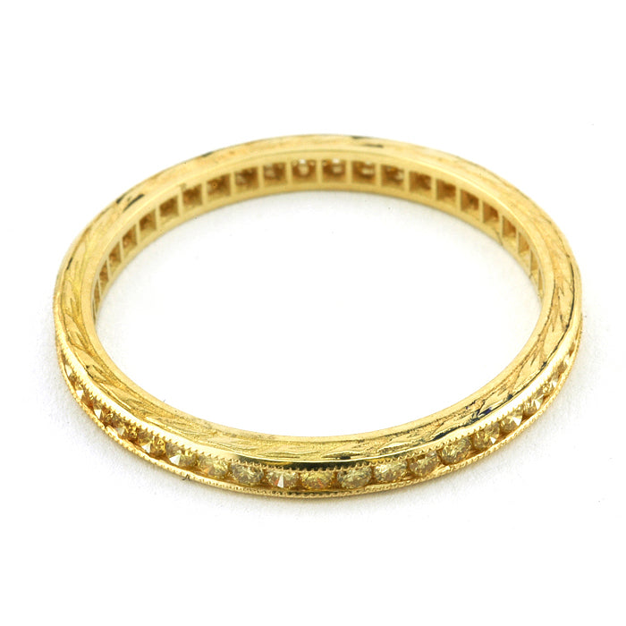 Contemporary ring: a Yellow Gold Channel Set Diamond Eternity Wedding Band sold by Doyle & Doyle vintage and antique jewelry boutique.