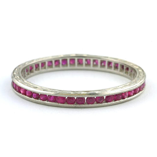 Contemporary ring: a Platinum Ruby Eternity Wedding Band, 0.40ctw sold by Doyle & Doyle vintage and antique jewelry boutique.