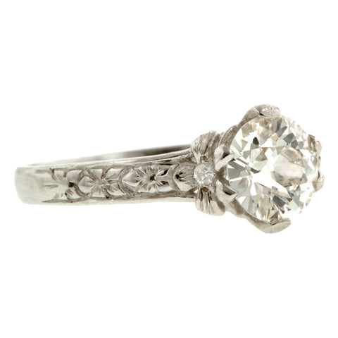 Contemporary ring: a Platinum Flower Shaped Old European Cut Diamond Heirloom Engagement Ring sold by Doyle & Doyle vintage and antique jewelry boutique.