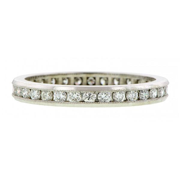 Contemporary ring; a Platinum Channel Set Round Brilliant Cut Diamond Eternity Band sold by Doyle & Doyle vintage and antique jewelry boutique.