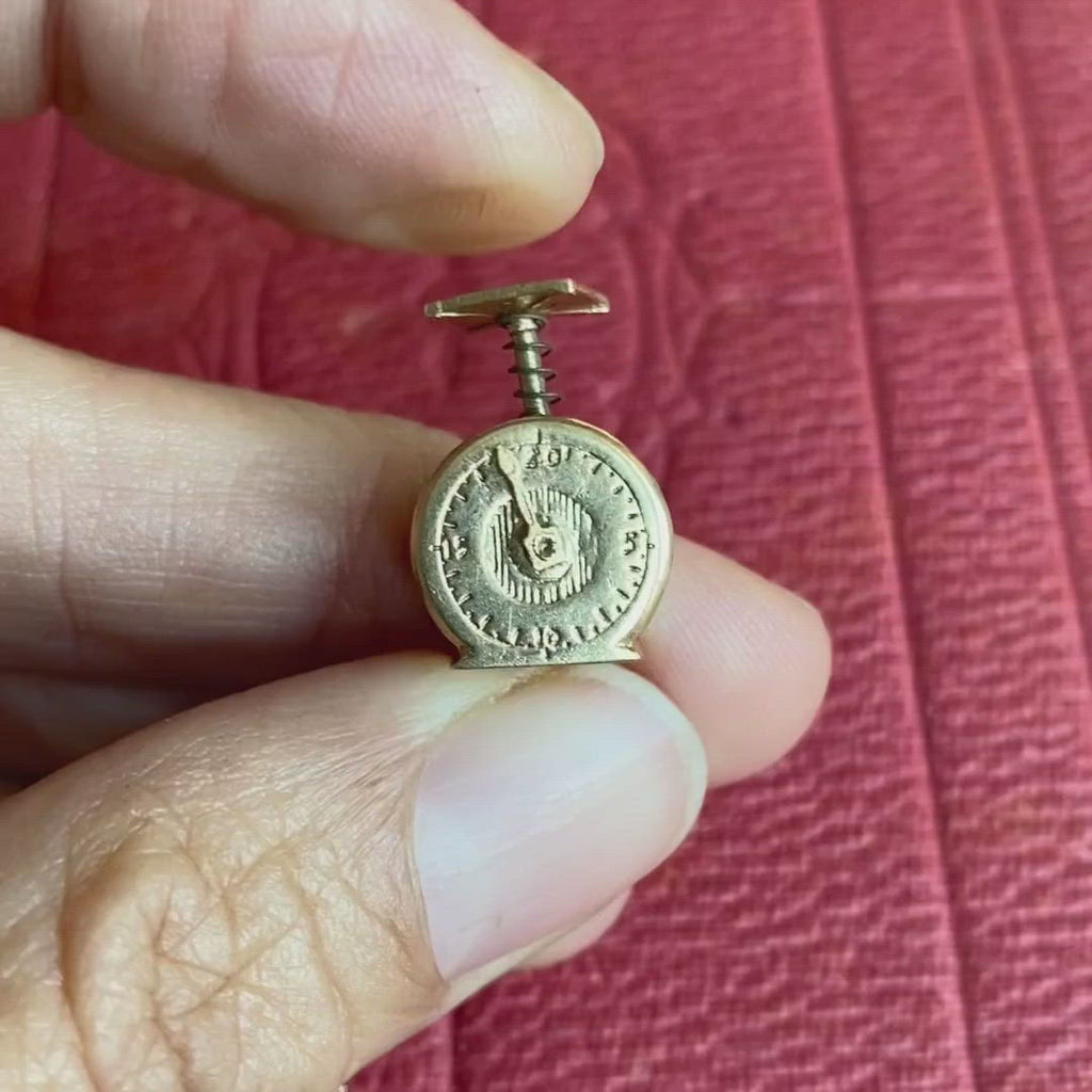 Vintage Mechanical Scale Charm sold by Doyle and Doyle an antique and vintage jewelry boutique