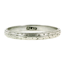 Vintage ring; a Platinum Patterned Wedding Band sold by Doyle & Doyle  vintage and antique jewelry boutique.