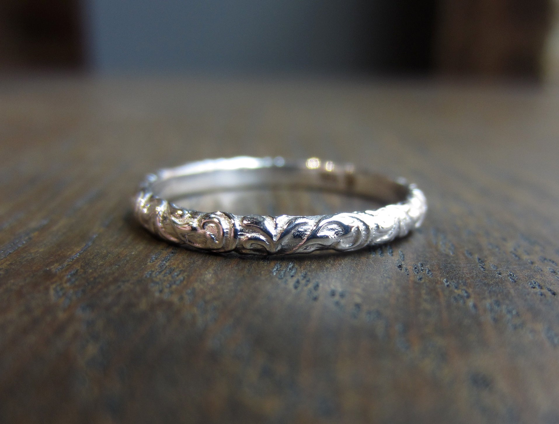 Contemporary ring: a White Gold Scrolling Pattern Band, Heirloom sold by Doyle & Doyle vintage and antique jewelry boutique.